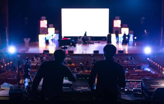 Professional stage lighting and audio production at a live event